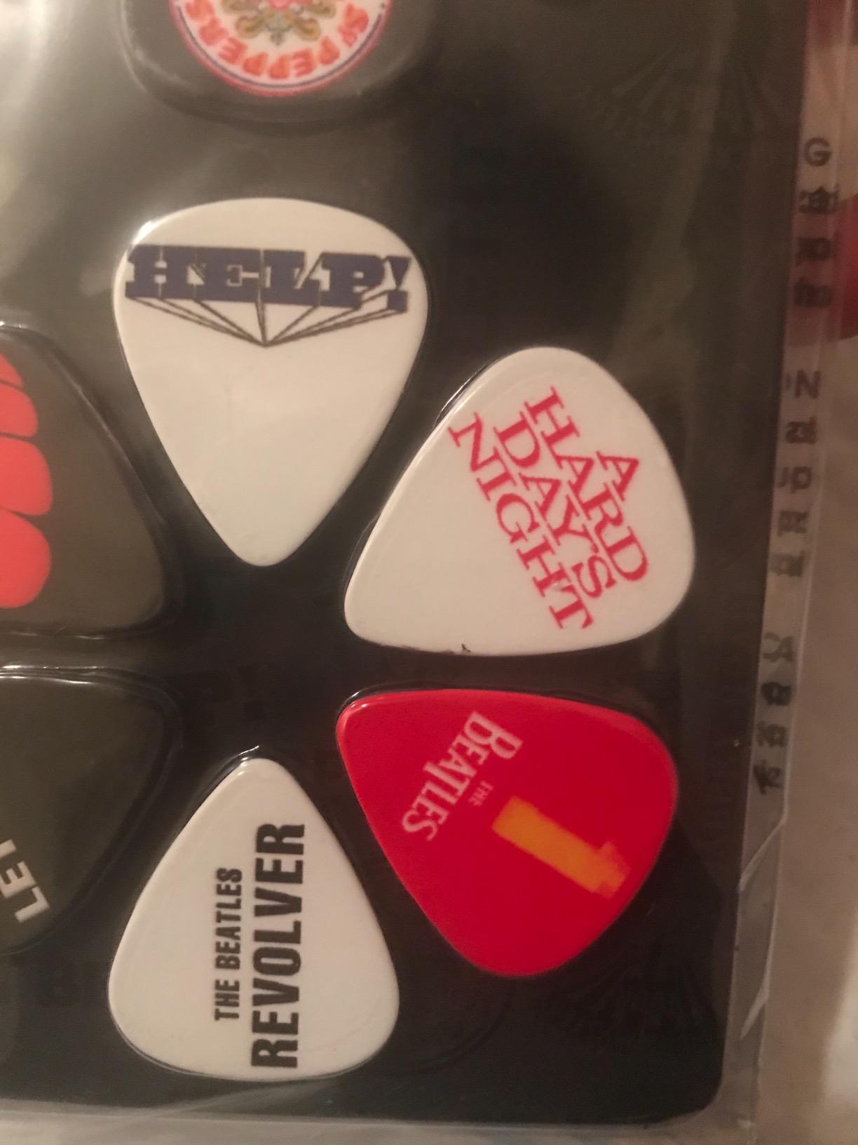 Guitar Picks - Medium 0.71mm - Pack of 12 - (TB2 Various Albums)