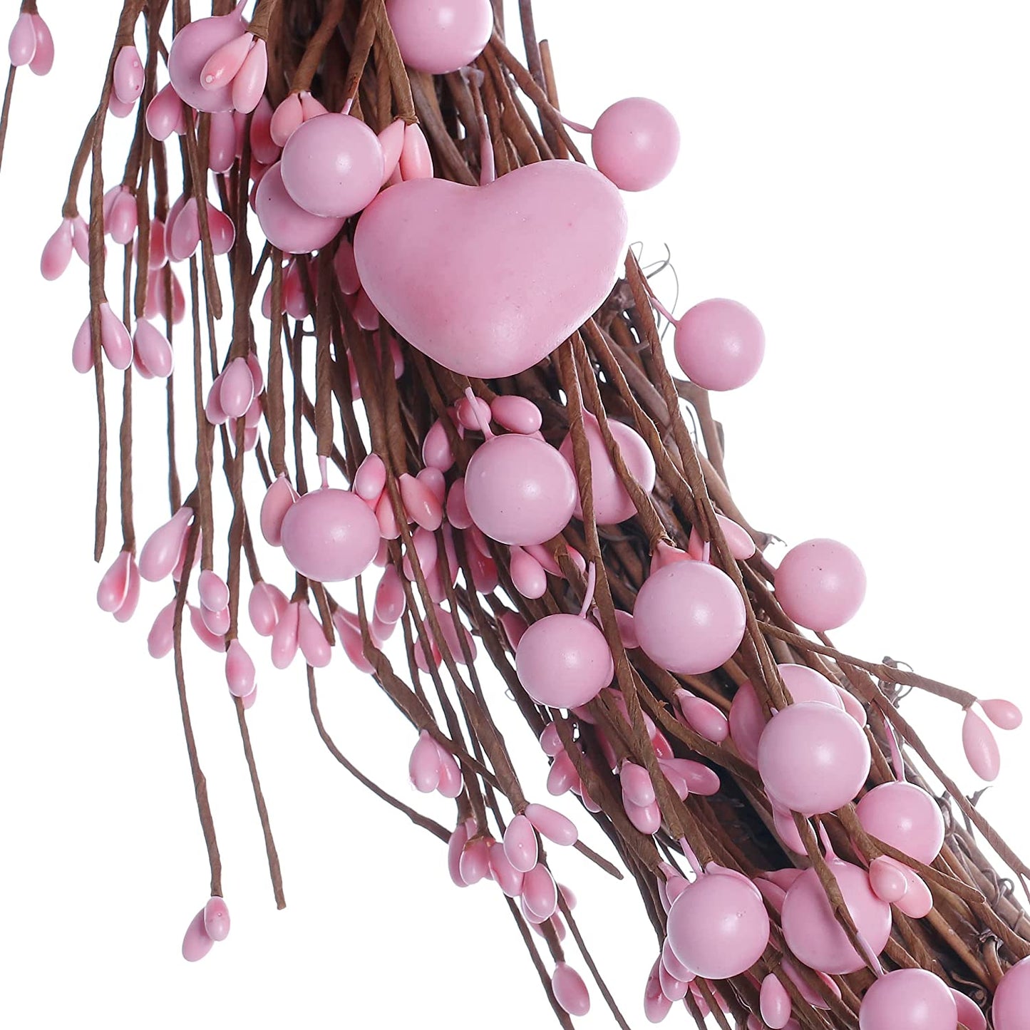 artificial heart-shaped wreath with pink hearts and berries