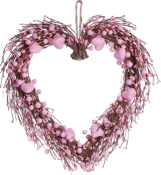 artificial heart-shaped wreath with pink hearts and berries