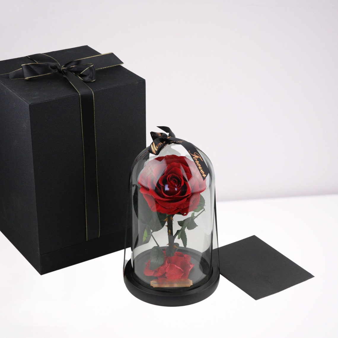 Real rose preserved in glass dome, red